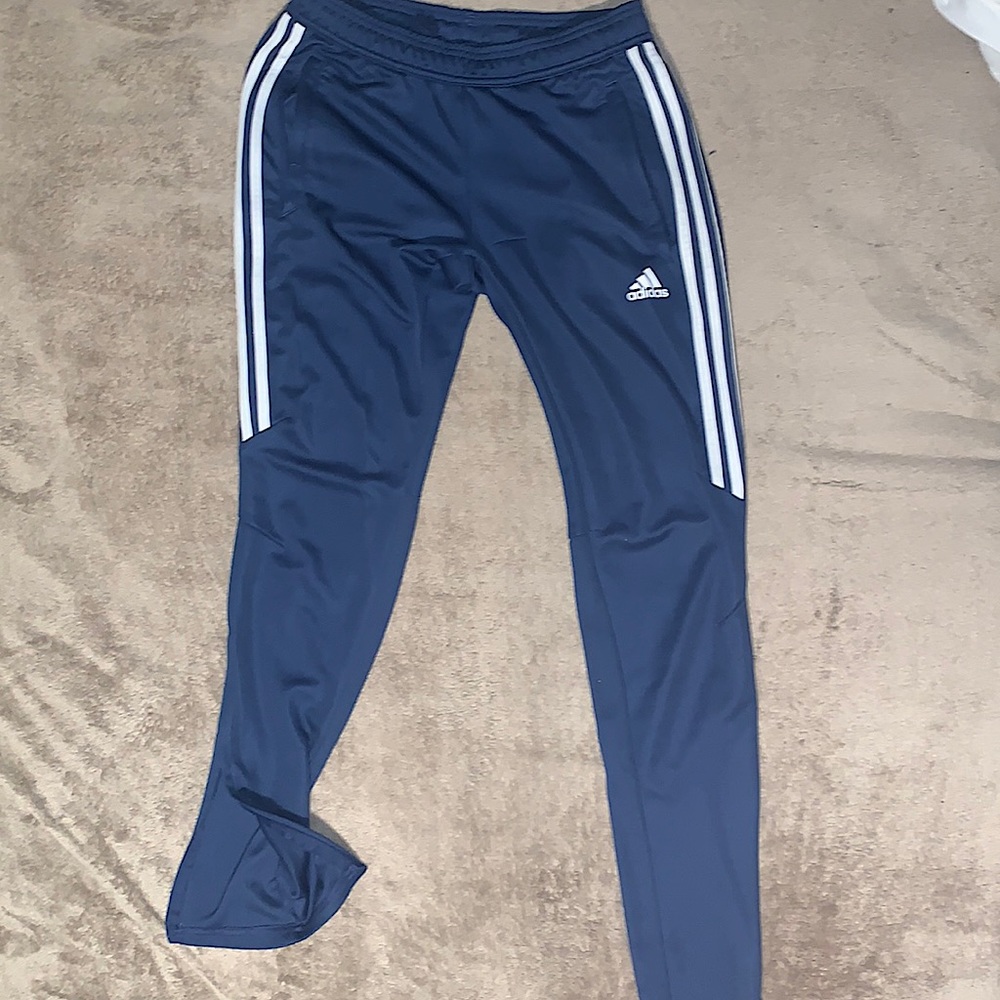 Small Blue Adidas Joggers, Zip pockets and Zip bottoms. Not too much stretch